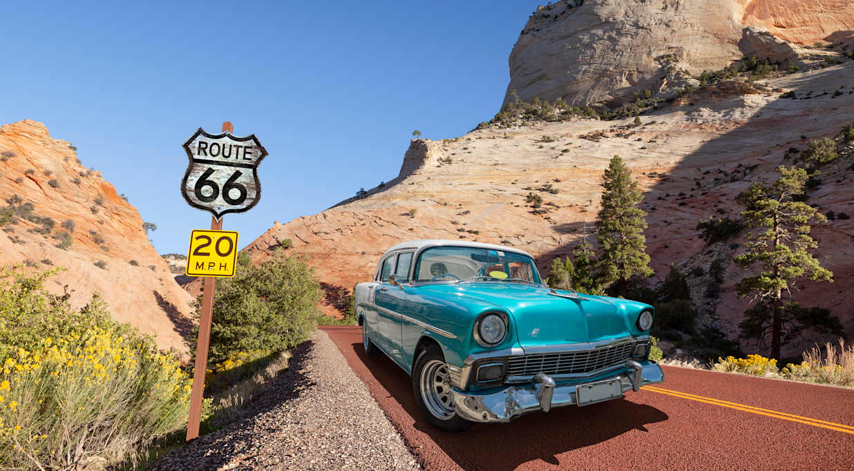 Vintage car oldtimer driving through National Park USA on Route 66